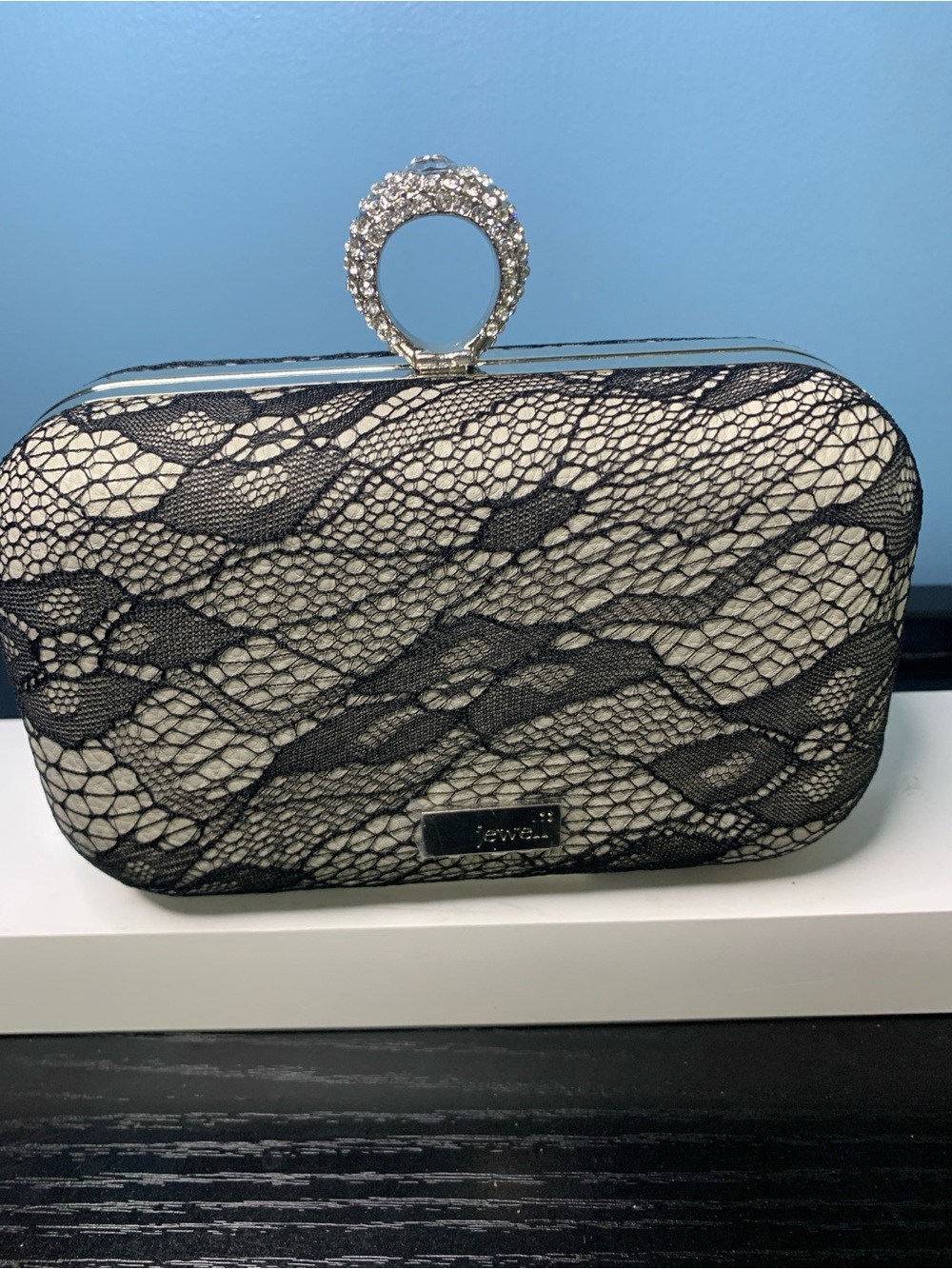 Evening Lace-Overlay Clutch with Crystal Ring Handle - Black on Cream